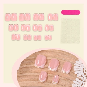 French press-on nail kit with pink base, white tips and gold lines including tool set