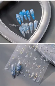 Detail of TL-299 winter nail art stickers with ice blue snowflakes and silver glitter