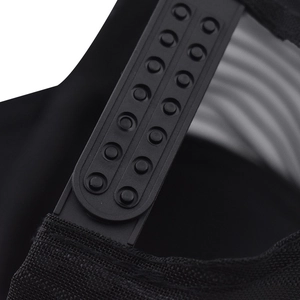 Close-up of the adjustable plastic snapback strap on a black mesh trucker cap