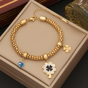 Golden double-layer flower necklace with evil eye charm and clover charms in jewelry box