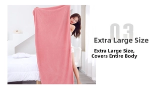 Detail of pink coral fleece bath towel featuring thick waffle texture for high absorption