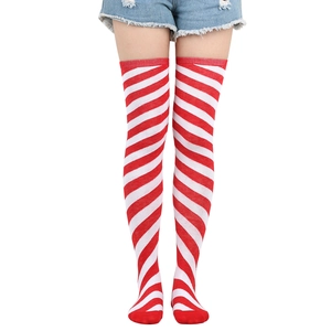 Detail of red and white striped over-knee high socks with premium knitted texture