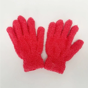 Close-up of rose pink exfoliating bath gloves with textured nylon scrub surface
