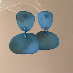Irregular geometric acrylic drop earrings with marble blue texture and silver needles
