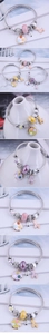 Detailed view of beaded charm bracelet with colorful glass beads and enamel pendants