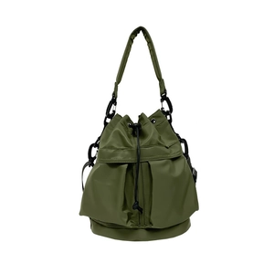 Olive green nylon drawstring bucket bag with adjustable wide shoulder strap and soft texture