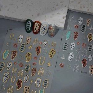Detail of CO-556 nail stickers with metallic animal prints and floral patterns on display