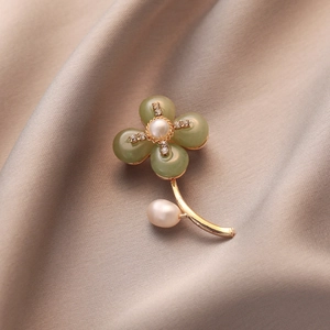 Elegant shell flower brooch with green petals, baroque pearls and gold floral stem