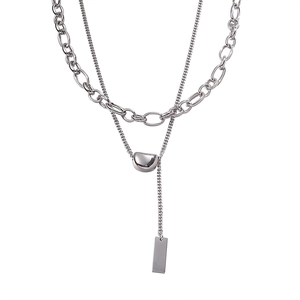 Double-layered stainless steel necklace featuring a lucky bean pendant and polished silver finish