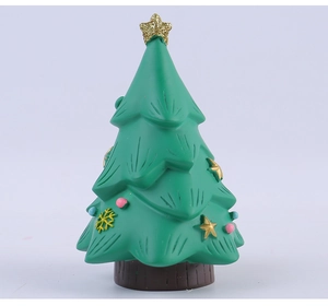 Detailed view of the green Christmas tree desk ornament with a gold glitter star top