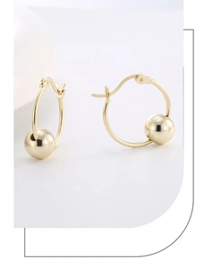 Detailed macro shot of the S925 hallmark on minimalist 14K gold plated sphere hoop earrings