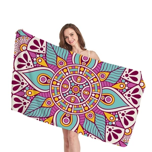 Bohemian mandala beach towel with purple and teal geometric patterns for vacation
