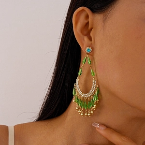 Vintage gold drop earrings with emerald green beads and sparkling crystal tassels