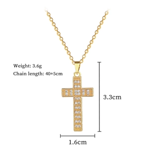 Detailed view of gold cross pendant with dimensions and weight specifications