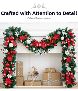 Close-up of 270cm Christmas garland with red bows and LED lights on white fireplace