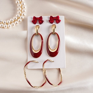 Elegant six-piece bow and oval enamel earring set in gold and deep red finish