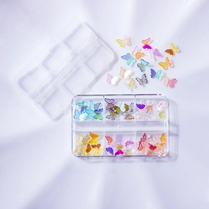 Nail art decoration set with colorful butterfly sequins in a transparent storage box
