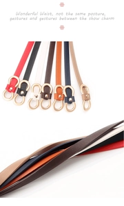 Detail of colorful slim waist belts featuring unique golden figure-8 buckles on white