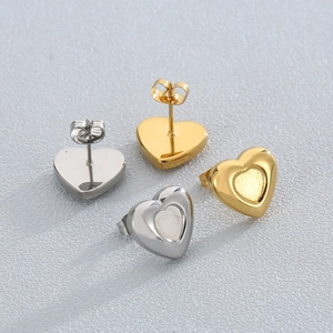 Minimalist heart stud earrings in gold and silver stainless steel with concave design