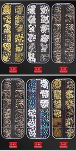Detailed selection of mixed metal studs and rhinestones in storage cases for nail art decoration