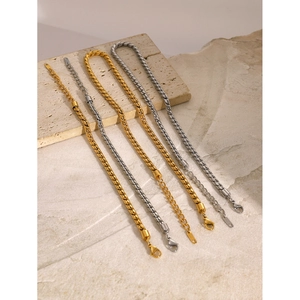 Sleek stainless steel flat curb chain bracelets in gold and silver finish on stone