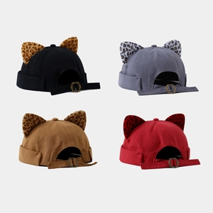 Detail of miki hats with leopard print ears and adjustable metal buckles in four colors