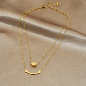 Collier double épaisseur en acier inoxydable doré avec pendentifs cœur et sourire sur soie