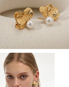 Detailed close-up of 316 stainless steel flower earrings with pearls and silk texture