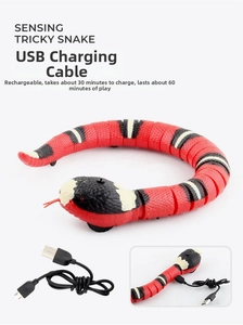 Detail of sensing snake toy with USB charging cable and power connection view
