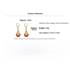 Detailed view of teardrop earrings with red beads and zircons showing 4.7cm x 1.5cm size