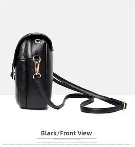 Side view of black lychee grain crossbody bag featuring dual zippers and golden hardware