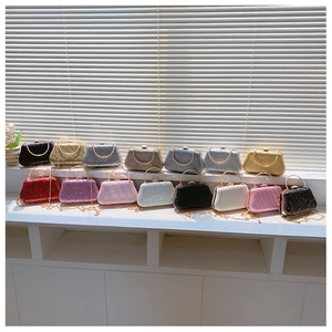 Collection of glitter evening clutch bags with gold handles and chains in various colors