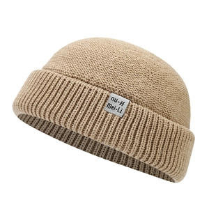 Retro khaki knit brimless docker hat with a fabric letter label for men and women