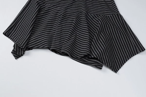 Detailed macro view of black and gray striped fabric texture and hemline craftsmanship