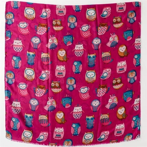 Close-up of colorful cartoon owl pattern on pink silk-feel scarf material