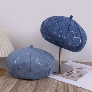 Detail view of winter teddy fleece baseball cap showing soft texture and floral patterns
