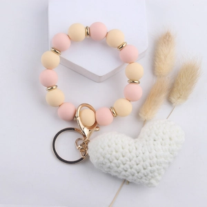 Beaded heart keychain wristlet with pink yellow silicone beads and white knit heart