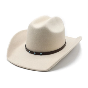 Detail of wool jazz hat with 9cm wide brim, brown strap and blue turquoise accents