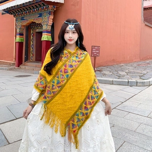 Ethnic style yellow knit shawl poncho with geometric patterns and fringe detail