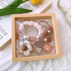 5-piece hair accessory gift set featuring fabric scrunchies and bow clips in milk tea tones