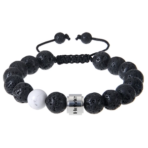 Close-up of black lava stone beads and custom engraved silver cylinder on woven bracelet