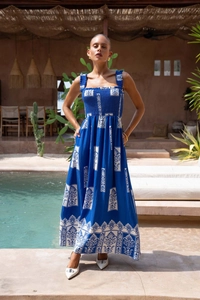 Close-up of blue and white floral printed beach maxi dress with textured fabric detail