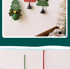 Detail of Christmas tree pendants with metal bells and festive greeting cards