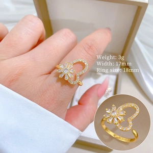 Detailed close-up showing 3g weight and 17mm width of the golden heart zircon ring