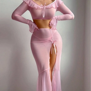 Sexy pink mesh two-piece set featuring flare sleeve crop top and side slit long skirt