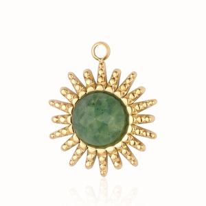 Detailed view of sun-shaped gold stainless steel pendant with green faceted gemstone
