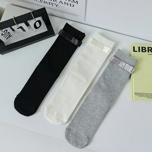 Three-pack ribbed knit JK calf socks in black, white, and grey with satin bow details