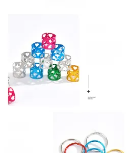 Macro shot of colorful metal hollow heart and round dreadlock beads for hair styling