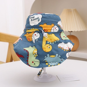 Detail of kids navy dinosaur sun hat with Sunny Day text on a white display stand