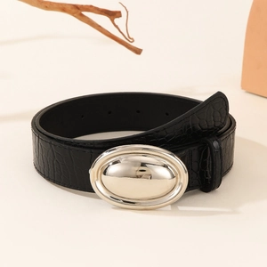 Close-up of black crocodile-textured leather belt with a polished silver oval buckle